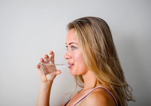 woman drinking water woman drinking hydrogen water